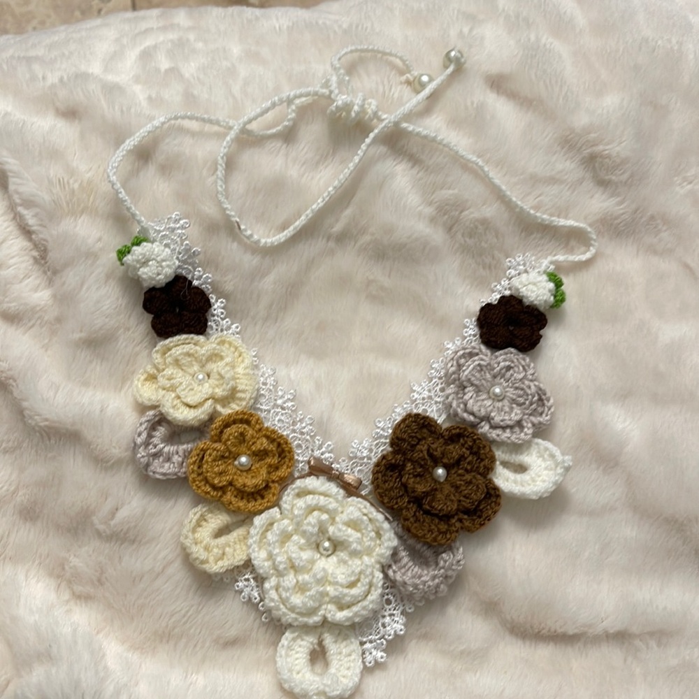 No brand . Made by hand . Color white cream and brown